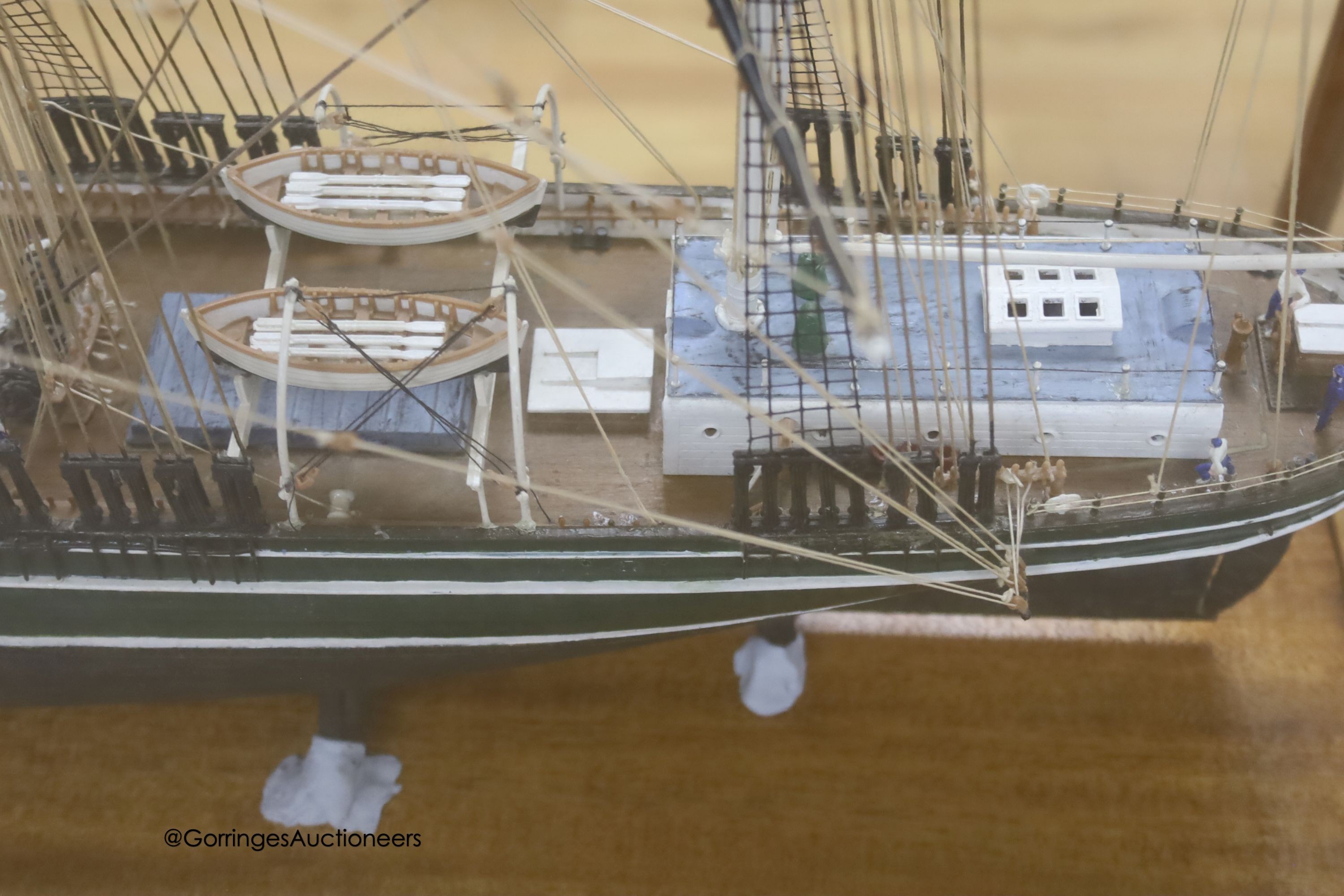 A model of a clipper ship in glazed case